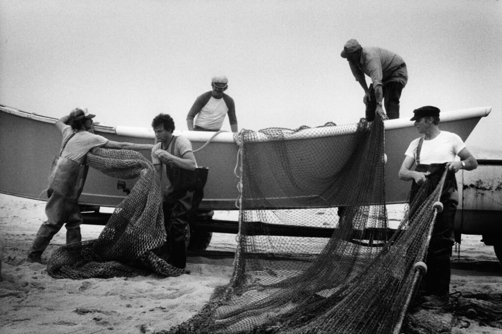 The Havens Ocean haulseining crew, from left-Billy Havens, Doug Kuntz,
Fred Havens Jr.(deceased), William Havens,(deceased), and Benny Havens as seen in 1983.
photo by Martine Franke
DO NOT USE BEFORE CONTACTACTING KAREN PROBASCO AT MAGNUM PHOTOS 212-929-6000  ext. 108
Slug LI Fish